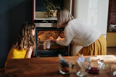 Woman and child home baking
