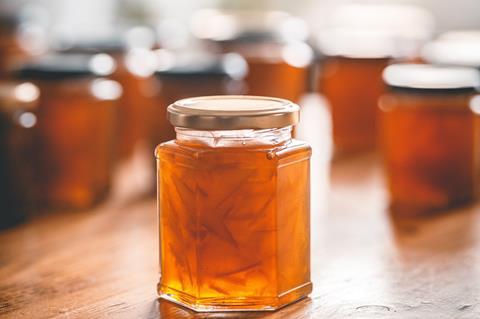 Jars of marmalade on counter