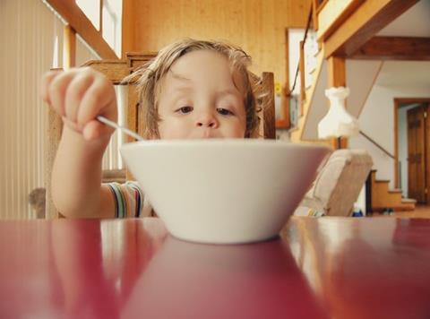 child eating cereal breakfast