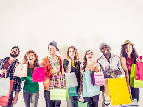 Young people Gen Z millennials with shopping bags high street