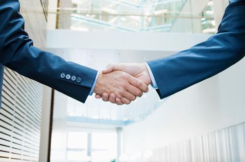 Business handshake shake hands Getty