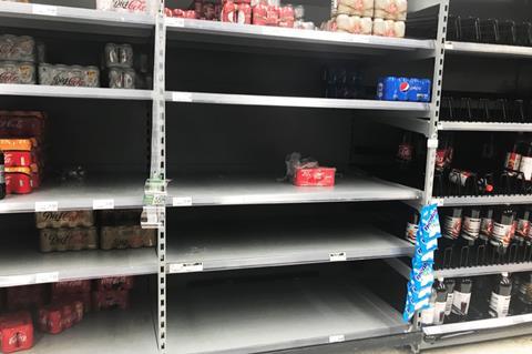 Asda near-empty soft drink shelves 