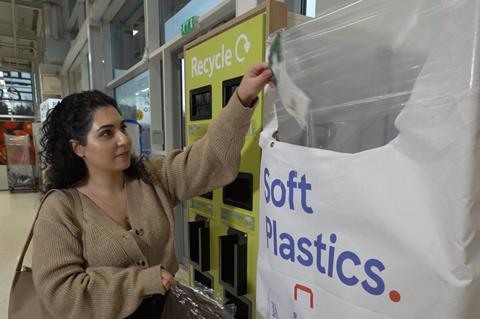 Shopper recycling soft plastic tesco