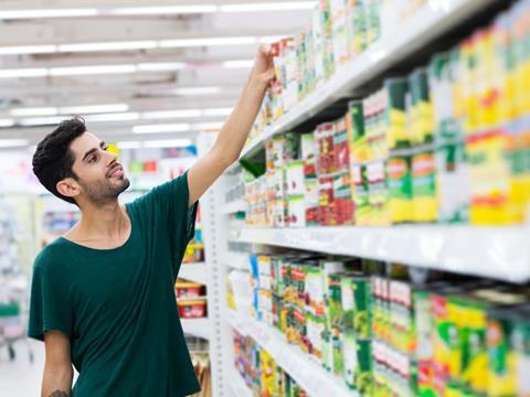 Young guy in the canned aisles