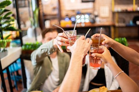 friends young drinks social alcohol GettyImages-1475879712