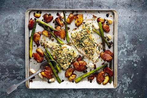 Herb crusted Norwegian haddock tray bake with crispy potatoes and asparagus