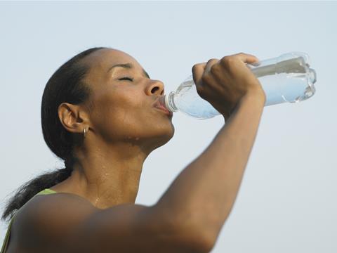 Woman drinking bottled water