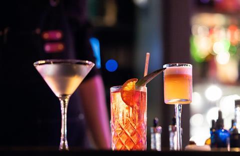 A row of cocktails on a bar