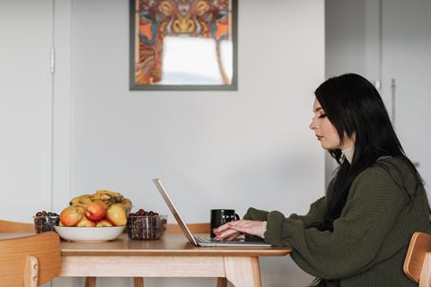 woman on laptop in kitchen