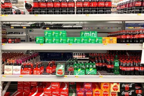 soft drinks coke sprite shelves aisle