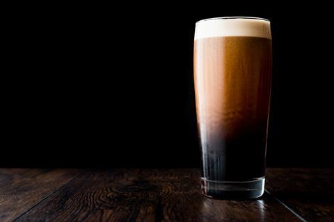 Stout beer on wooden surface