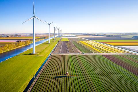 farming farm wind turbine sustainable sustainability eco climate change GettyImages-1396844586