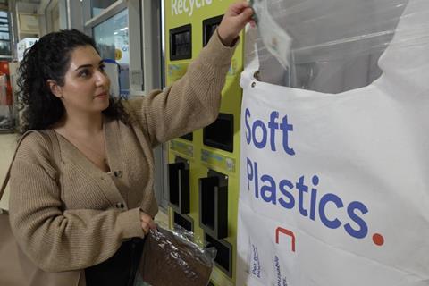 Shopper recycling soft plastic tesco