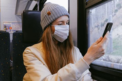 woman in mask on train coronavirus