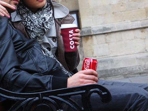 Man drinking Costa Cofee and Coca-Cola