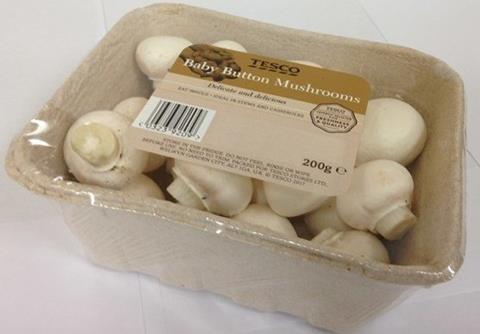 Prepacked mushrooms in a punnet covered with clear plastic