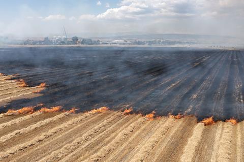 farm field fire wildfire climate global warming GettyImages-1795140803