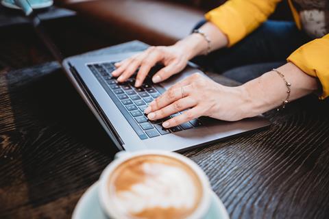 Woman on laptop computer coffee