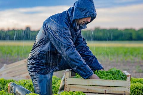 rain farm farmer worker weather GettyImages-1284909747
