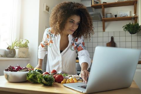 woman cooking laptop computer recipe