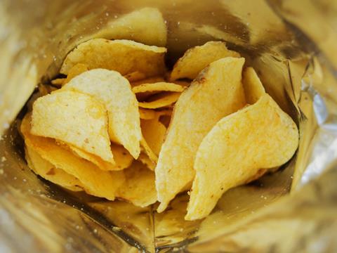 Potato crisps in an open bag