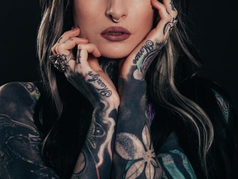 woman with tattoos and piercings
