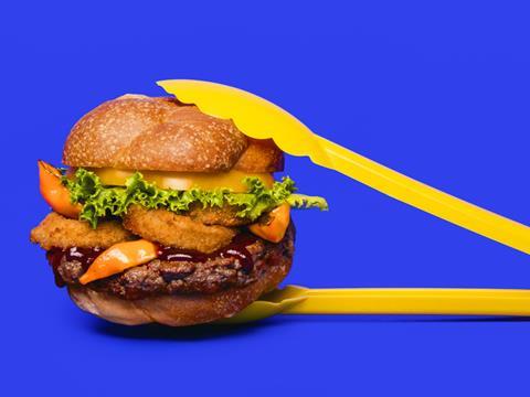 Impossible Foods plant-based vegan Impossible burger lifestyle shot with tongs