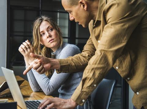 Woman listening to a man conversation discussion office team work