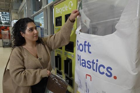 Shopper recycling soft plastic tesco