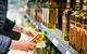olive oil shelf aisle shopper GettyImages-1429975593