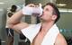man drinking protein shake gym